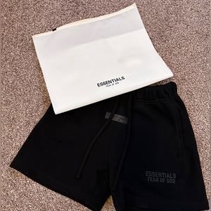 Black Essentials shorts kids size Medium runs small.